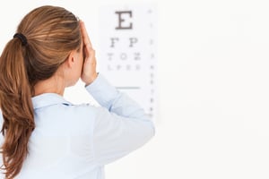 Brunette woman making an eye test in a surgery